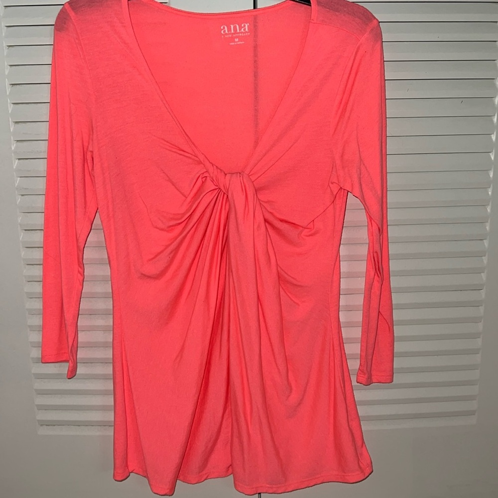 Very bright pinkish orange long sleeved  t-shirt with faux knot in front.